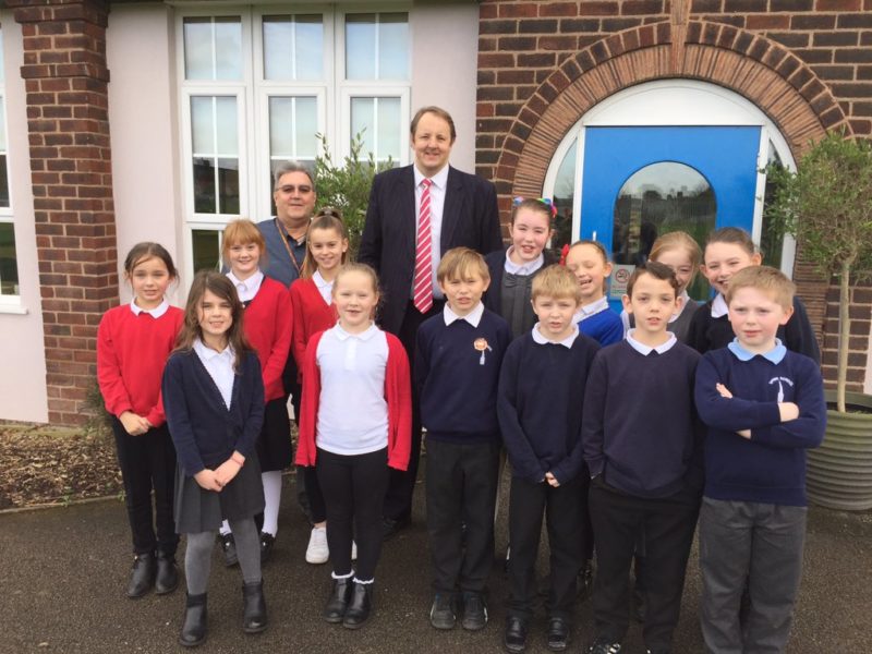 Toby with Spire Junior School pupils and governor, Cllr Keith Miles, earlier this year