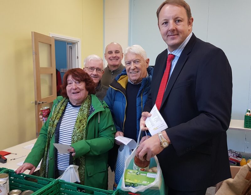 Toby with food bank volunteer Jim, and local councillors Avis Murphy, Tom Murphy and Ray Catt