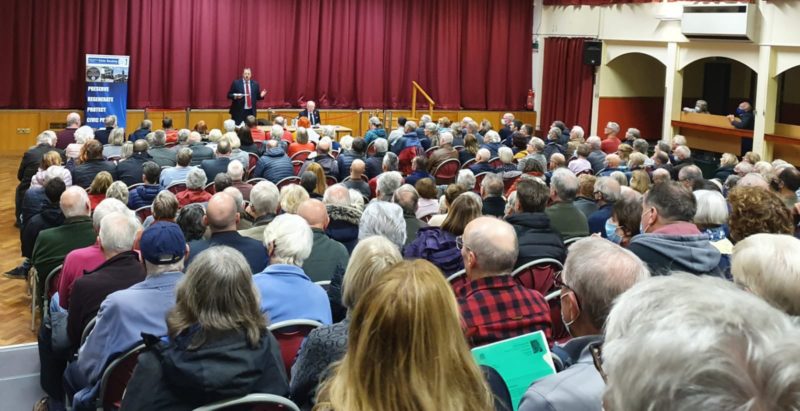 Toby speaking to a packed public meeting attended by over 250 people