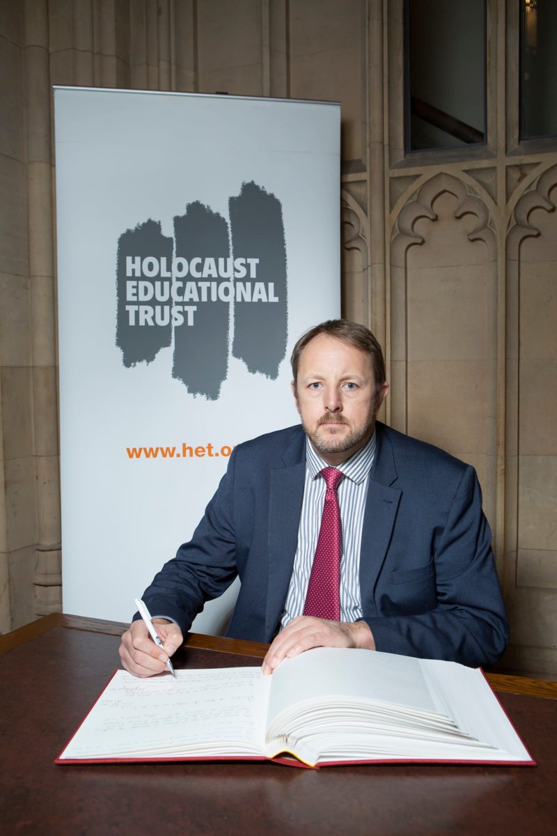 Toby Perkins signing the Holocaust Educational Trust Book of Commitment 